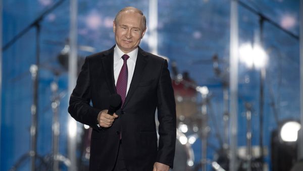 Президент РФ Владимир Путин выступает на концерте-митинге Россия. Севастополь. Крым в Севастополе. 14 марта 2018