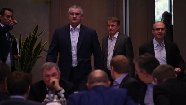 Глава Крыма Сергей Аксенов на расширенном заседании Госсовета РФ в Ялте под руководством президента России Владимира Путина. 23 ноября 2018